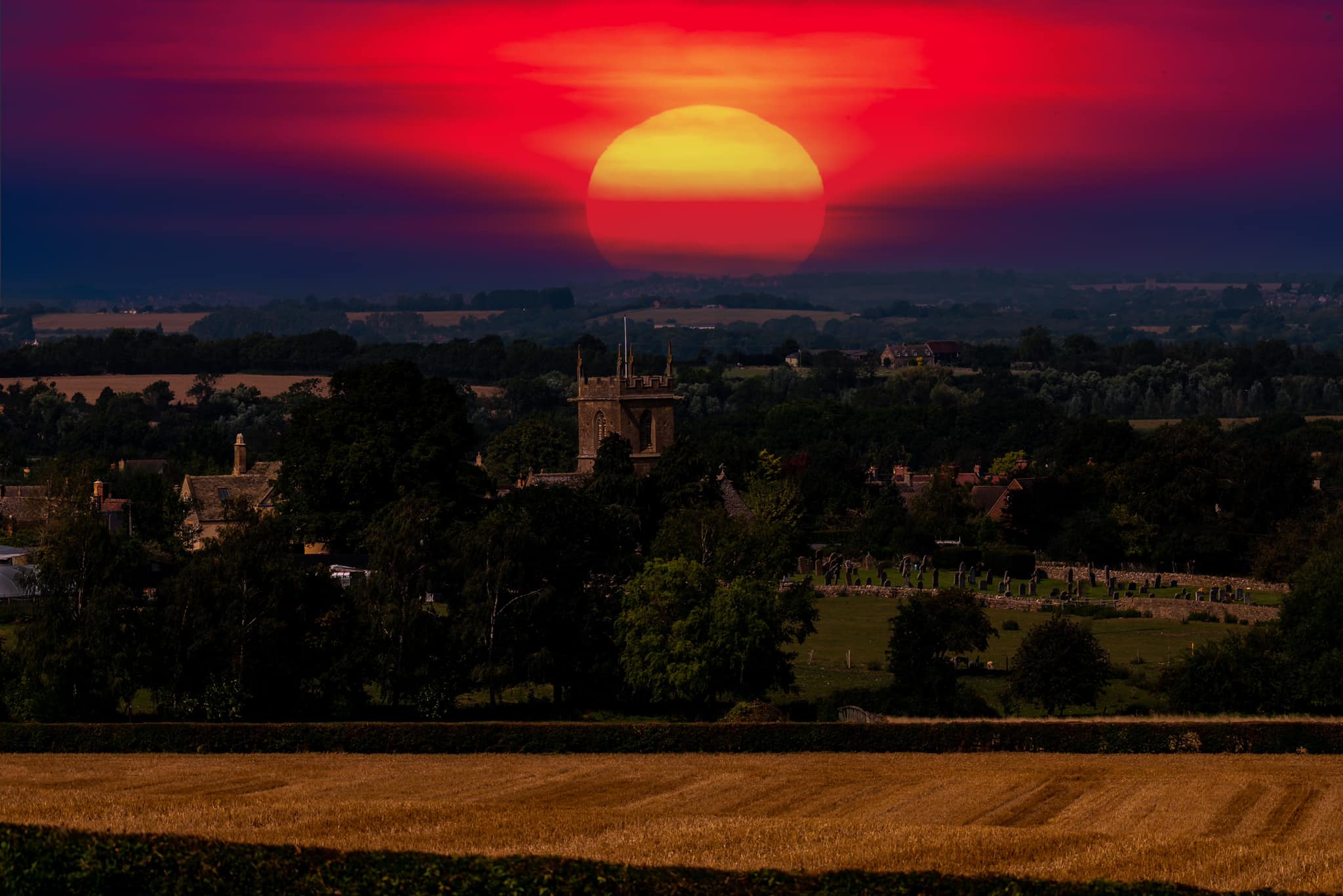 Willersey Church with red sun